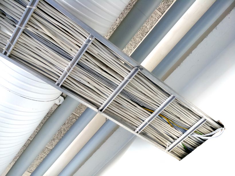 Cable tray carrying bundled electrical cabling